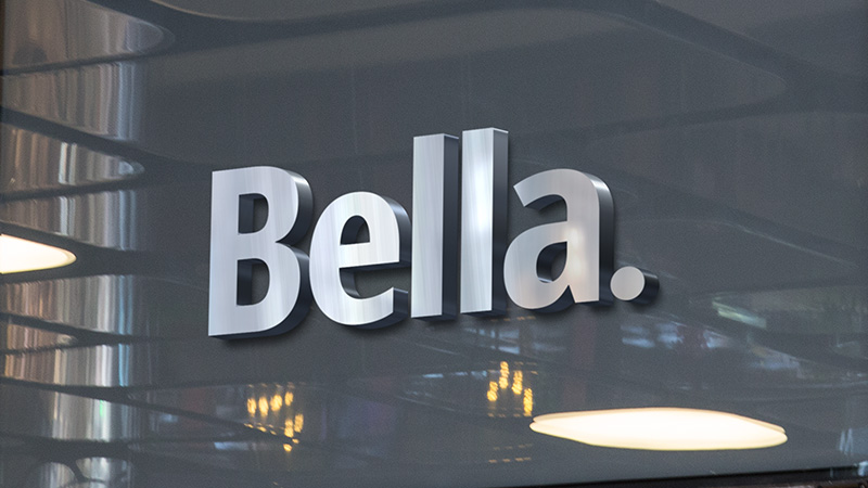 Bella branding shown on a building facade